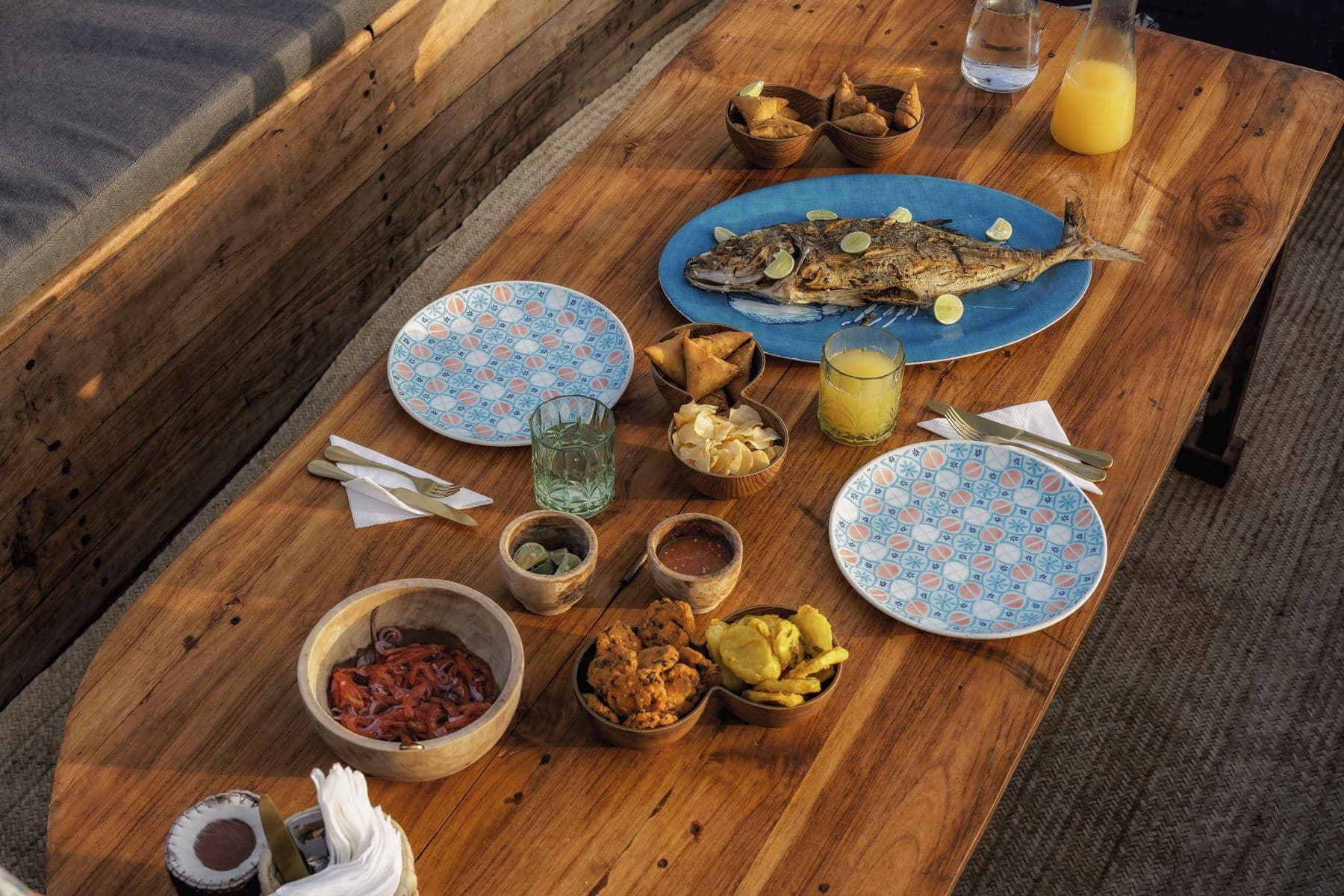 A grilled fish lunch for two on the sandbank