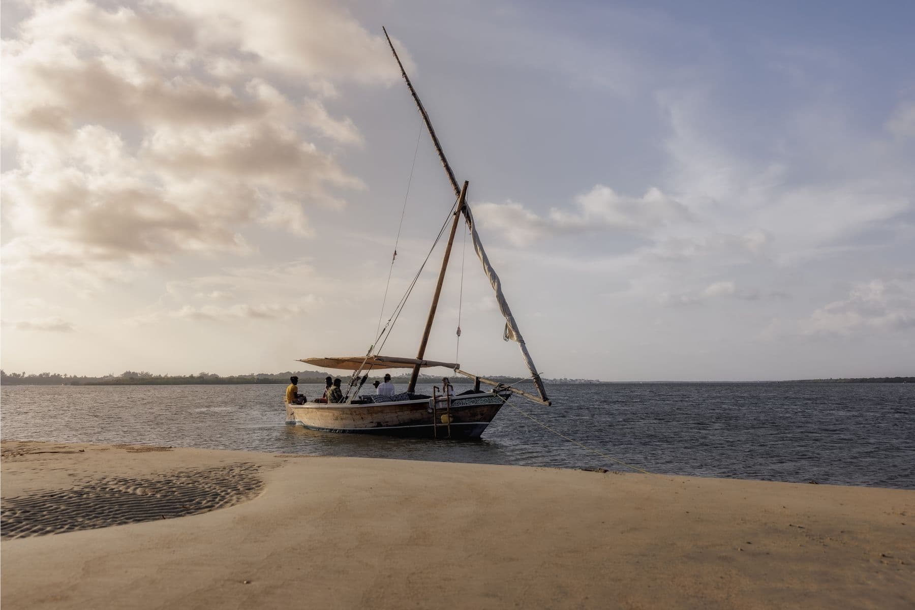 A dhow resting on a Lamu sandbank at dusk
